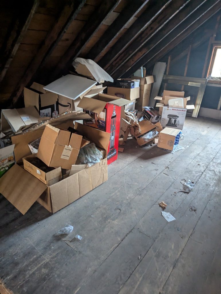 Property interior with boxed contents before cleanup