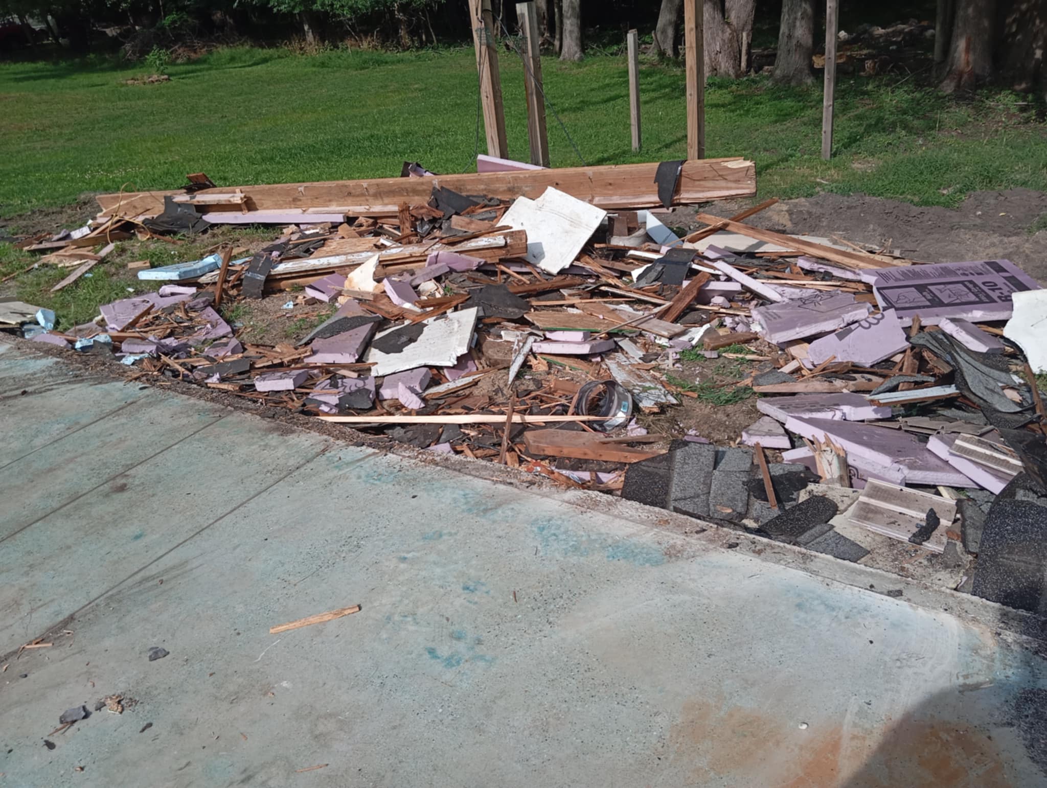 Construction and demolition debris staged for cleanup